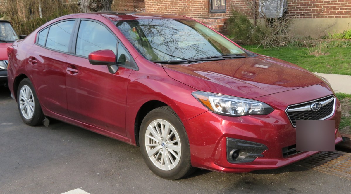 Subaru Impreza пятого поколения (GK/GT), красный седан, вид спереди сбоку